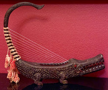 No. 11 Artifacts "Crocodile Musical Harp". The artistry of this carved instrument is magical.
