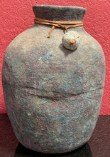 No. 18 Artifacts - Stone pottery Water Jar with Leather String. The String Wraps Around Neck With a Little Rock